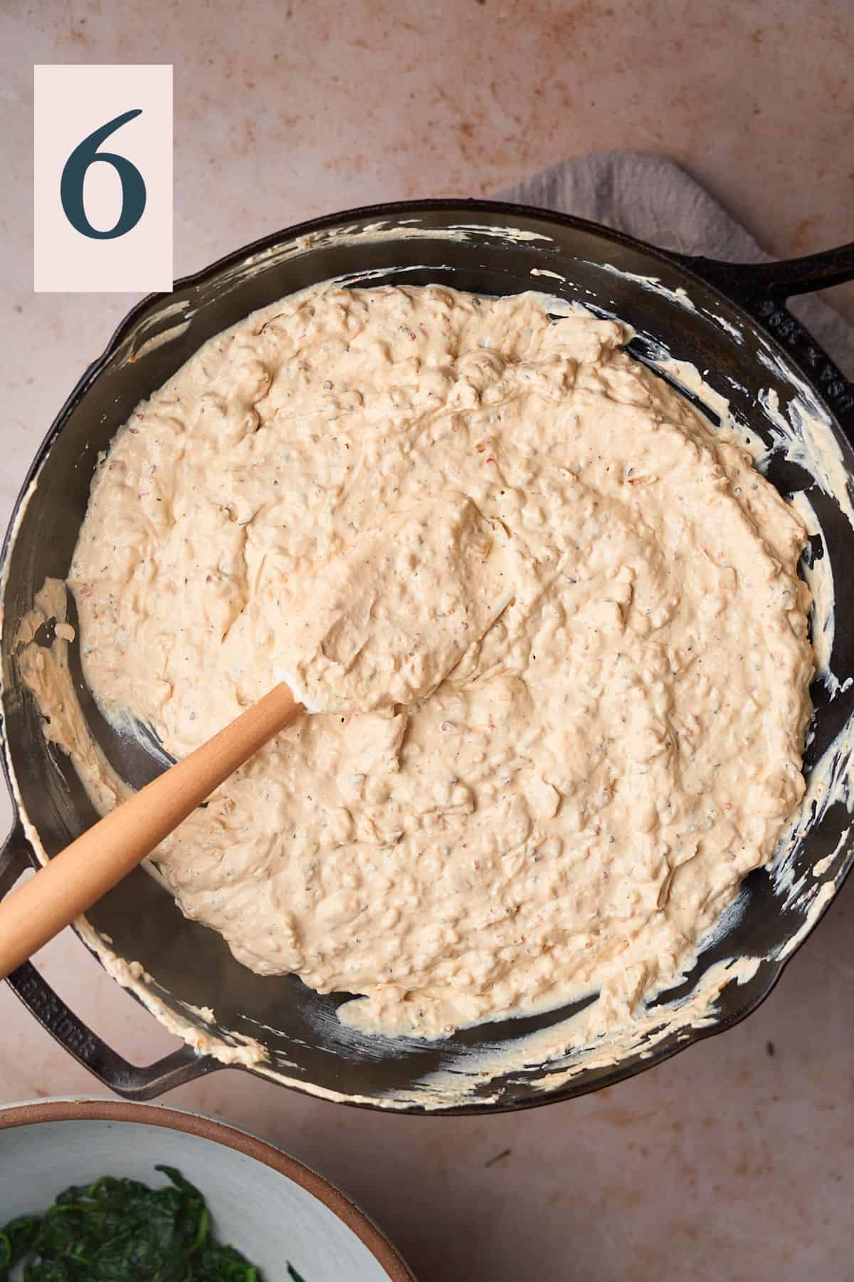 smooth and creamy mixture of sour cream and cream cheese in a skillet with onion and seasonings. 