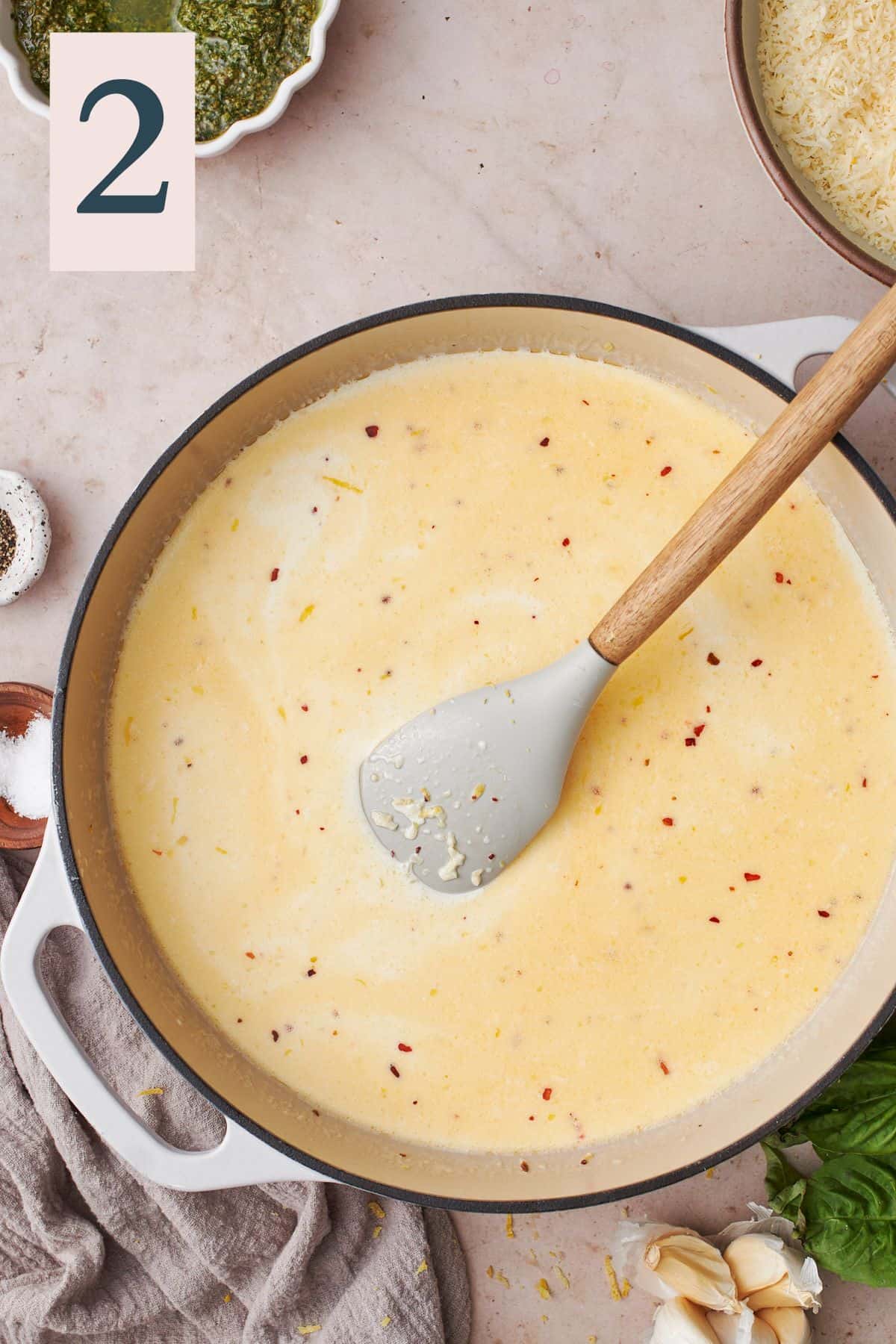 cream sauce forming in a large enameled skillet. 