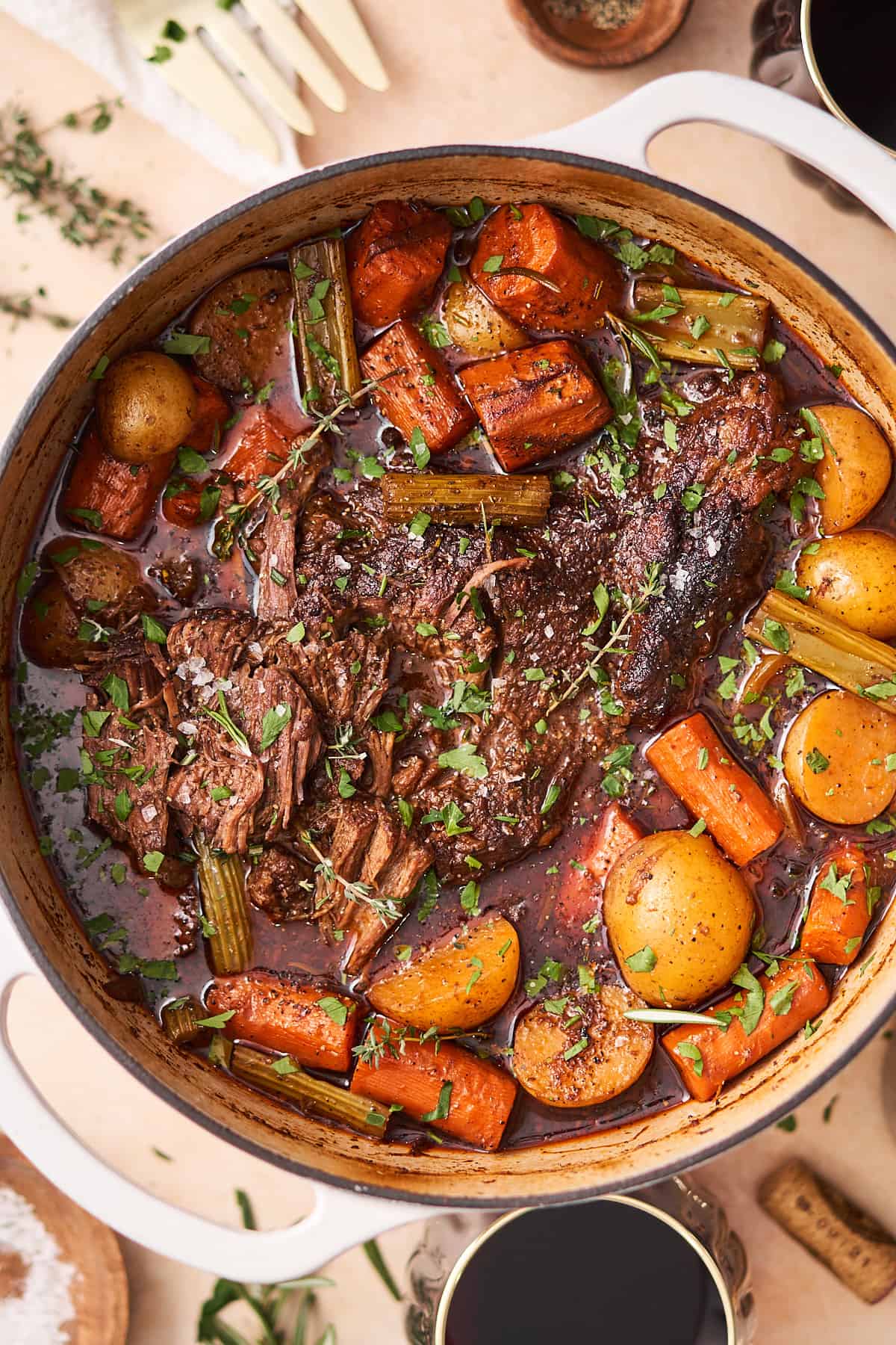 dutch oven pot roast with potatoes, fresh thyme, flakey sea salt, carrots, and more in a hearty broth. 