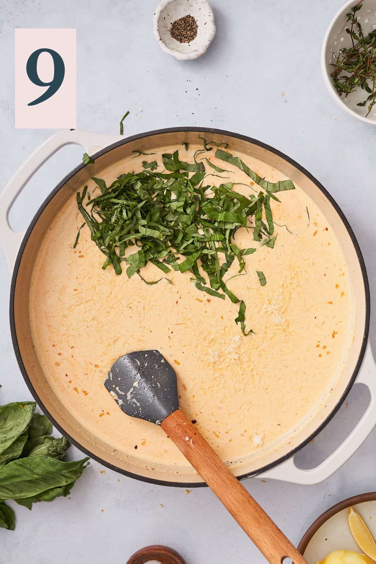 cream sauce with fresh basil in a skillet.