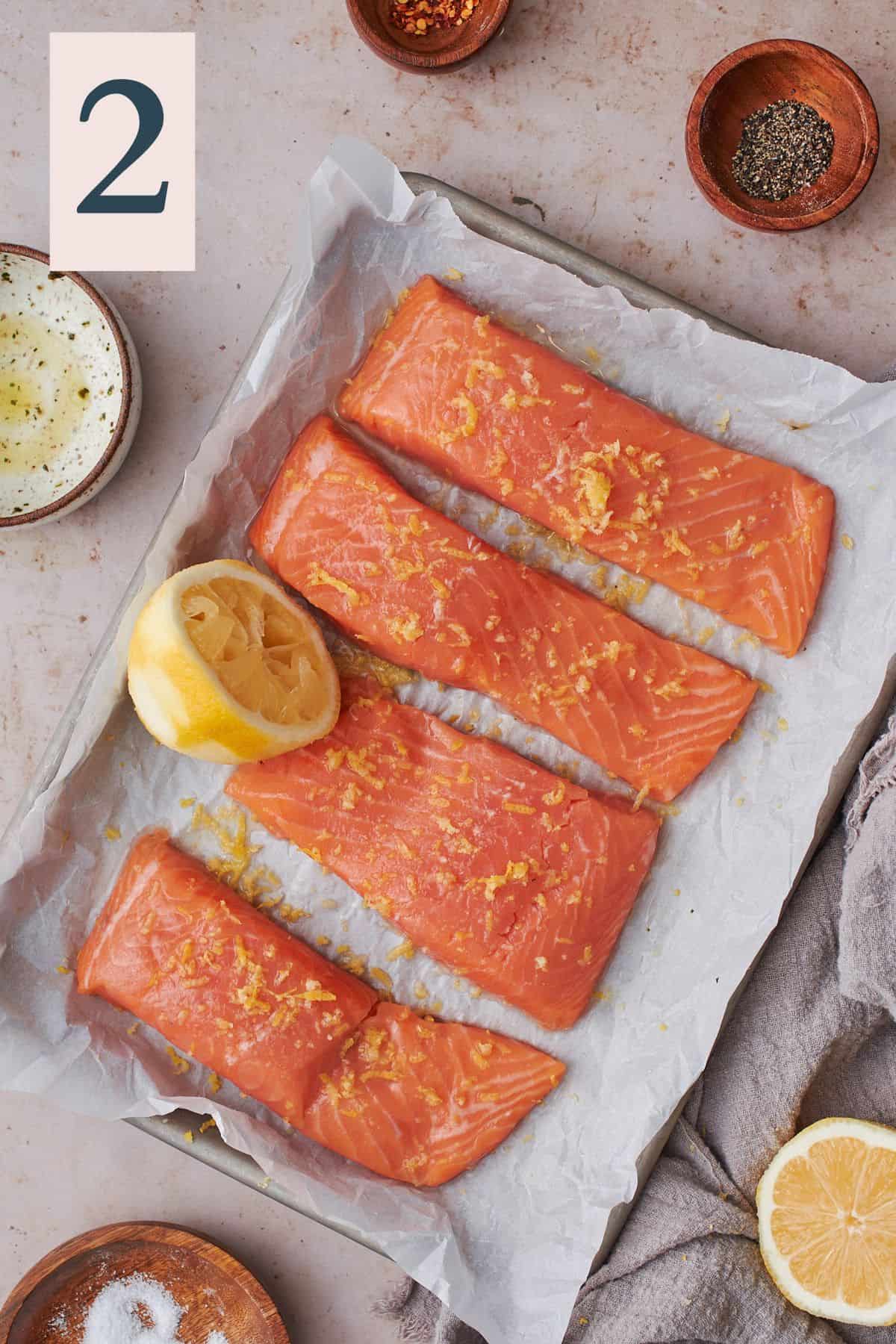 Salmon topped with lemon zest and juice.