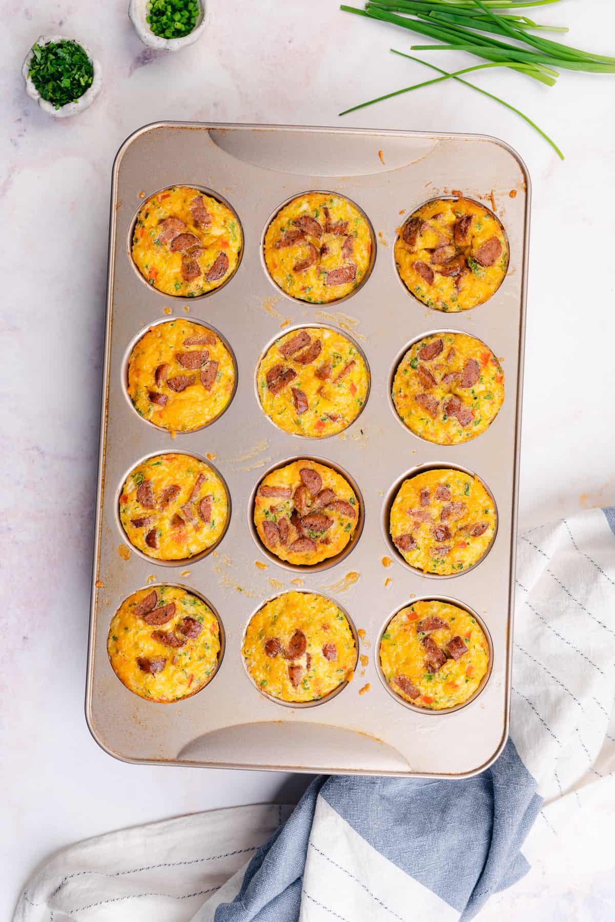 baked sausage and egg muffins in a muffin tin