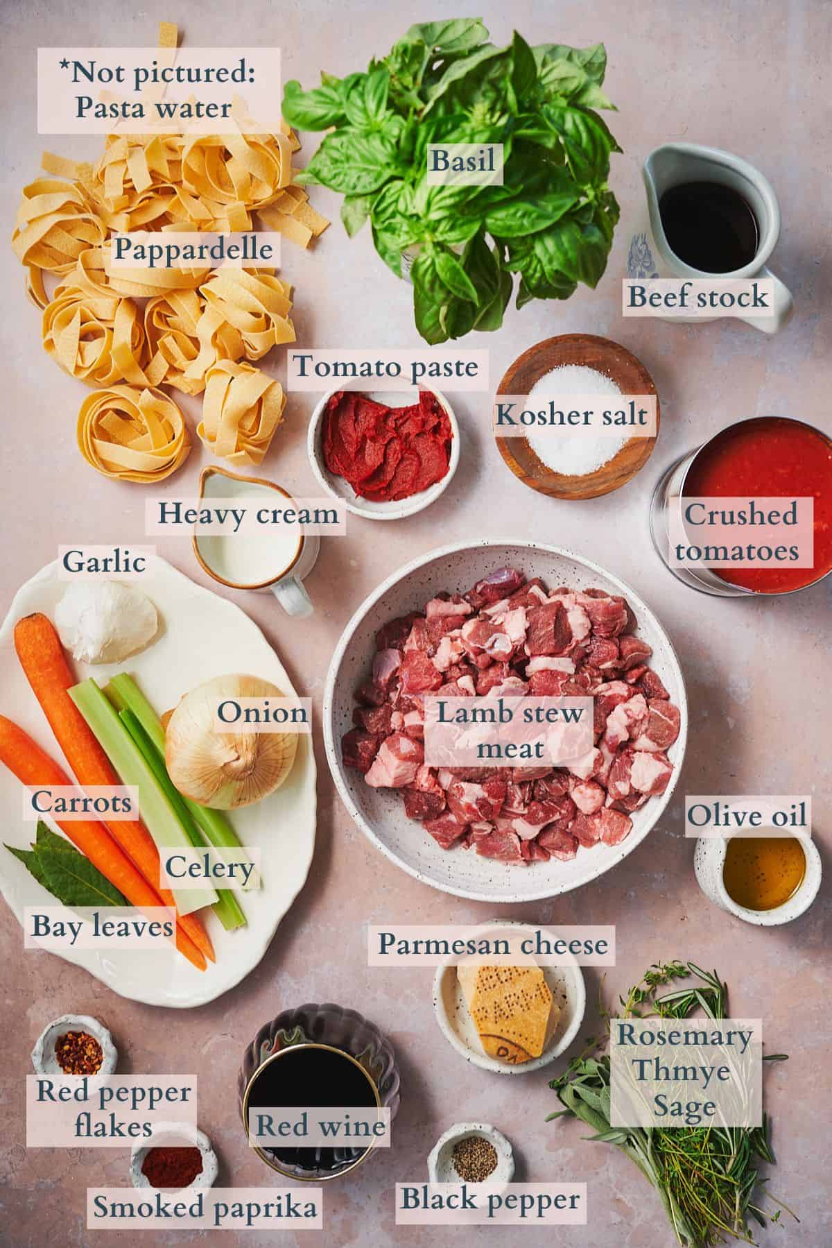 Ingredients to make slow cooker lamb ragu labeled to denote each ingredient. 