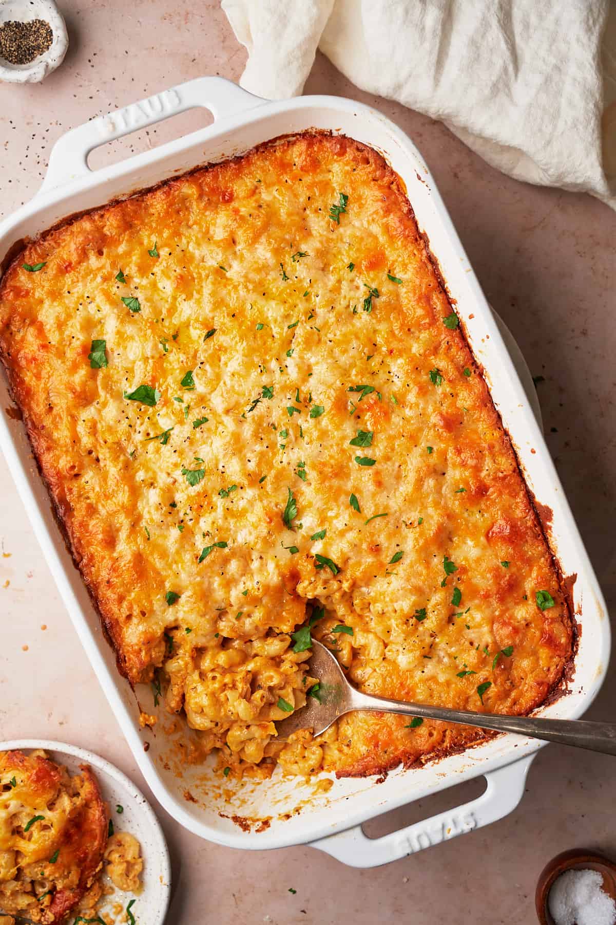 A crispy browned and cheesy mac and cheese in a casserole dish.